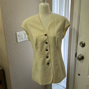 Cap-sleeve linen blazer/vest. Tacked in shoulder pads are easily removable.